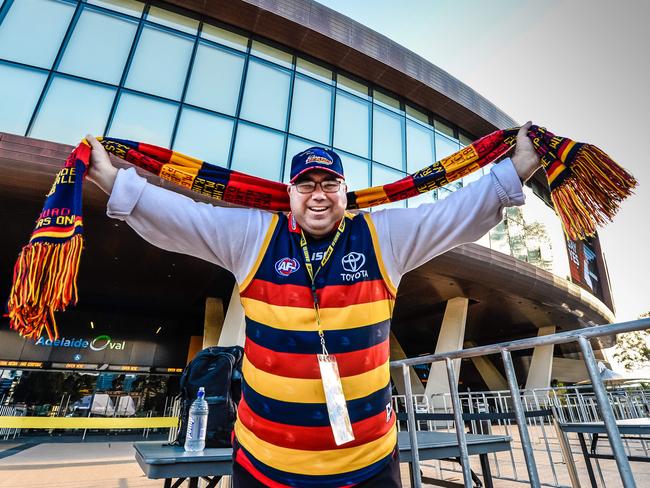 Crows fan Jarrad Payze was the first in, having lined up since 7am to get his tickets. AAP/ROY VAN DER VEGT