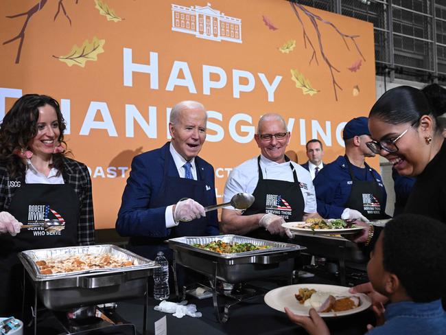 US President Joe Biden serves food at a "Friendsgiving" dinner with service members and their families at the Coast Guard Sector New York in Staten Island, New York. Picture: AFP