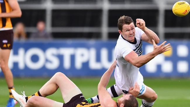 Patrick Dangerfield of the Cats handballs while being tackled by Jarryd Roughead of the Hawks during the 2017 JLT Community Series match between the Hawthorn Hawks and the Geelong Cats at University of Tasmania Stadium on February 17, 2017 in Launceston, Australia. (Photo by Quinn Rooney/Getty Images)