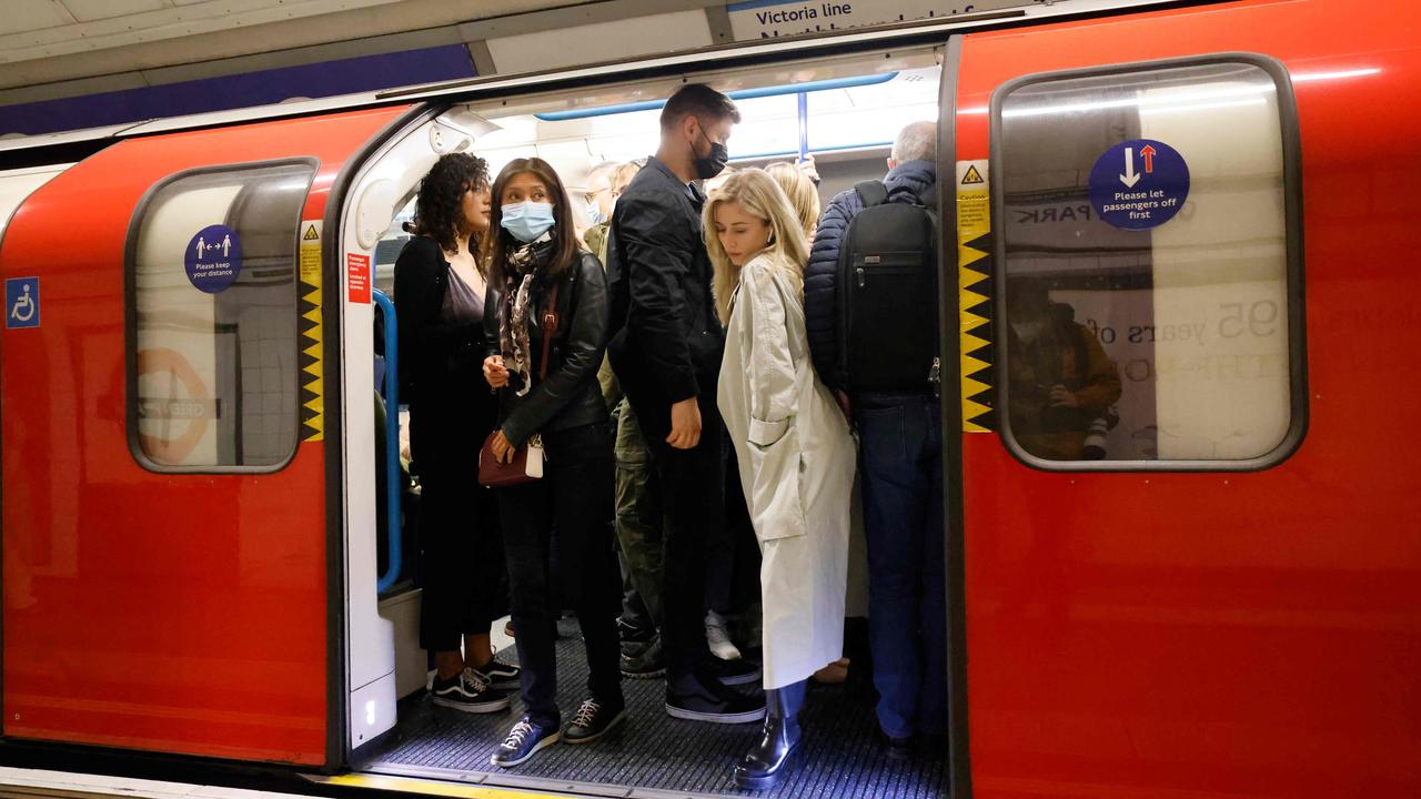 London’s tube is back to being busy again. (Photo by Tolga Akmen / AFP)