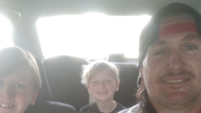 Richard Symes, who died on Wednesday February 23 about 1.45pm when he was crushed by a car at his home at Strathpine, with his boys Calen and Axton. Photo: contributed.