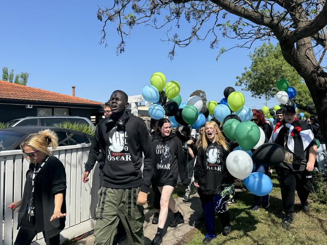 The group prepares to release balloons in memory of Oscar. Picture: Regan Hodge