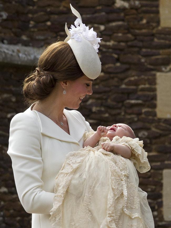 Catherine, Duchess of Cambridge, carries Princess Charlotte of Cambridge as they arrive at the Church of St Mary Magdalene on the Sandringham Estate for the Christening of Princess Charlotte of Cambridge on July 5, 2015 in King’s Lynn, England. Picture: Getty