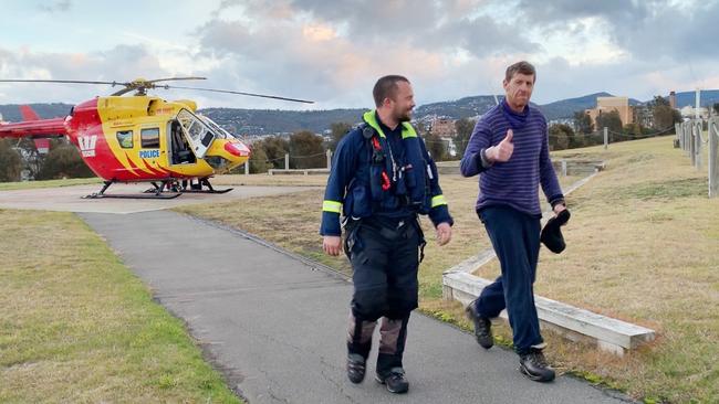 Michael Bowman arrives in Hobart after being found in the wilderness. Picture: Chanel Kinniburgh