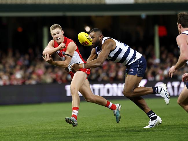 Sydney's Braeden Campbell tackled by Geelong's Esava Ratugolea. Picture: Phil Hillyard