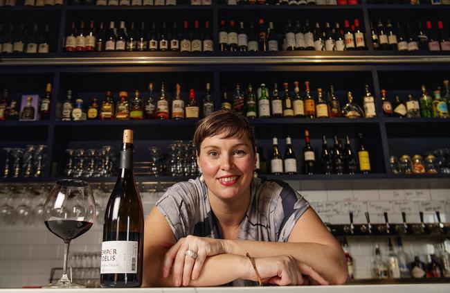 Stone House owner Rebecca Bullen with a glass of red wine. The bar won the best wine list in the NT. Picture: KERI MEGELUS