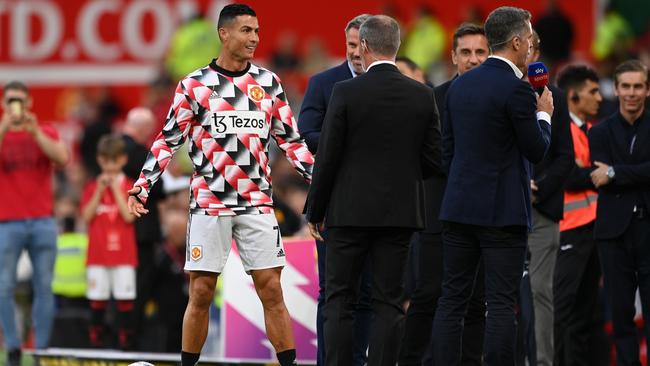 Cristiano Ronaldo of Manchester United interacts with Sky Sports Pundit, Roy Keane. Photo by Michael Regan/Getty Images.