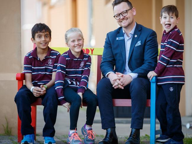 12/9/2019 Principal Luke Ritchie with students Thinuk (year 3), Emmie (year 2) and Harry (year 1) at Annesley Junior School.