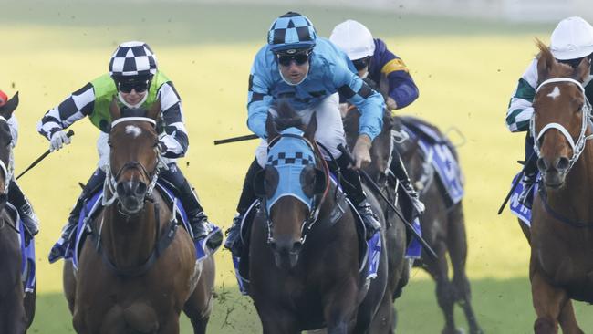 SYDNEY, AUSTRALIA - AUGUST 21: Tommy Berry (blue and black checks) on Mo'unga wins race 8 from James McDonald on Verry Elleegant the Winx Stakes during Sydney Racing at Royal Randwick on August 21, 2021 in Sydney, Australia. (Photo by Mark Evans/Getty Images)