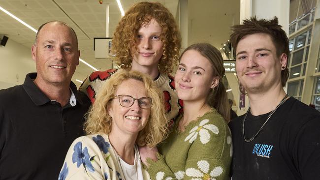 Jason Parker, Kane Parker, 16, Lisa Parker and Mia Parker, 19, with her partner, Josh Wilson, at Adelaide Airport, after Kane modelled for Prada in Milan. Picture: Matt Loxton