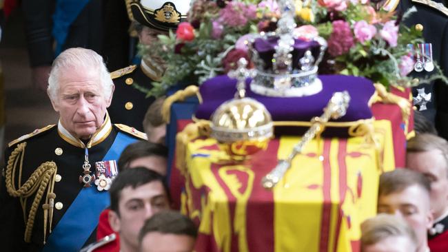 LONDON, ENGLAND - SEPTEMBER 19: King Charles III follows behind the coffin of Queen Elizabeth II, draped in the Royal Standard with the Imperial State Crown and the Sovereign's orb and sceptre, as it is carried out of Westminster Abbey. after the State Funeral of Queen Elizabeth II on September 19, 2022 in London, England. Elizabeth Alexandra Mary Windsor was born in Bruton Street, Mayfair, London on 21 April 1926. She married Prince Philip in 1947 and ascended the throne of the United Kingdom and Commonwealth on 6 February 1952 after the death of her Father, King George VI. Queen Elizabeth II died at Balmoral Castle in Scotland on September 8, 2022, and is succeeded by her eldest son, King Charles III. (Photo by Danny Lawson - WPA Pool/Getty Images)