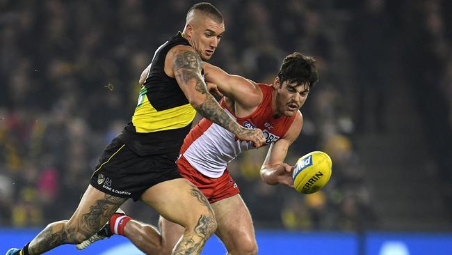 George Hewett goes head to head with Dustin Martin. Picture: AAP