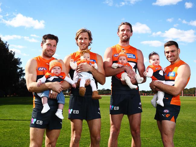 Keeffe (2R) is keen for his AFL career to continue into 2025 and create more memories for his young son, Penn. Picture: Brett Costello