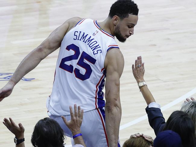 PHILADELPHIA, PENNSYLVANIA - JUNE 20: Ben Simmons #25 of the Philadelphia 76ers bumps into fans during the fourth quarter during Game Seven of the Eastern Conference Semifinals against the Atlanta Hawks at Wells Fargo Center on June 20, 2021 in Philadelphia, Pennsylvania. NOTE TO USER: User expressly acknowledges and agrees that, by downloading and or using this photograph, User is consenting to the terms and conditions of the Getty Images License Agreement.   Tim Nwachukwu/Getty Images/AFP == FOR NEWSPAPERS, INTERNET, TELCOS & TELEVISION USE ONLY ==