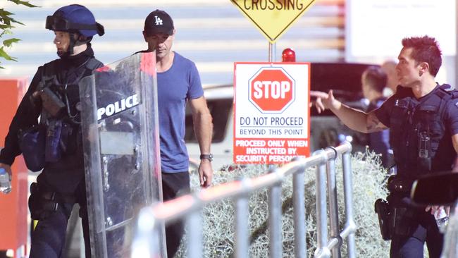 Police Incident Response Team members exit the Parkville Youth Justice Precint. Picture: Tony Gough