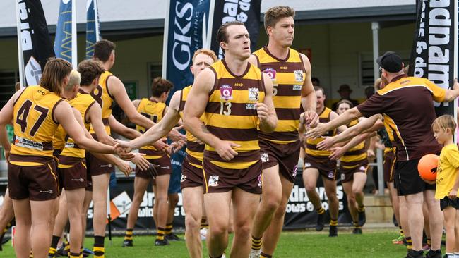 Aspley QAFL captain Brandon Batchelor leads his team out onto the field. Picture: Highflyer Images.