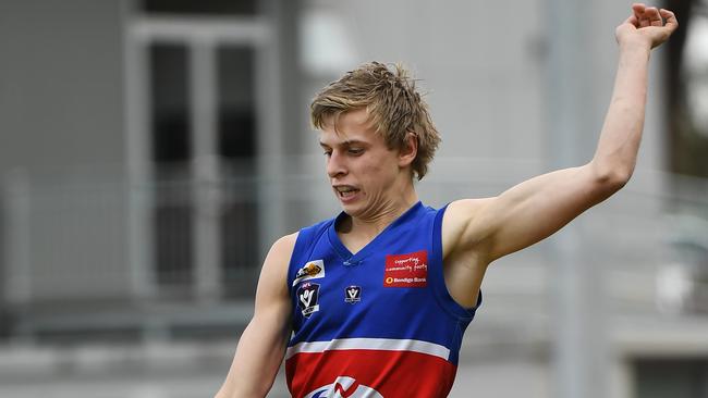 Daniel Hurst of Wandin gets a kick away in Emerald on September 8. Picture: James Ross