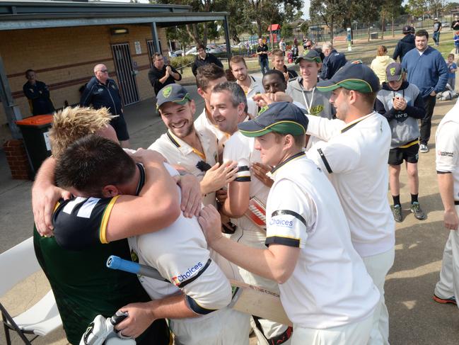 Sean Ayres and Andrew Bennett embrace after Plenty Valley’s grand final win over Roxburgh Park/Broadmeadows in 2014-15. Picture: Angie Basdekis