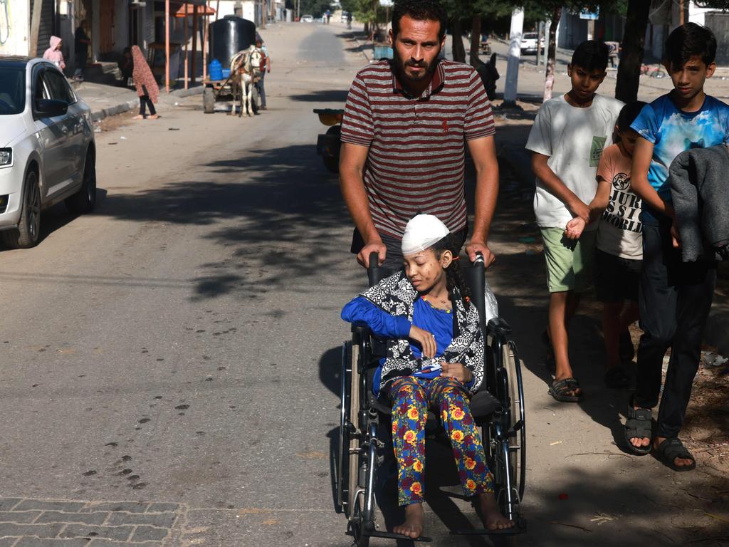 A wounded girl is transported on a wheelchair in Rafah in the southern Gaza Strip. Picture: AFP
