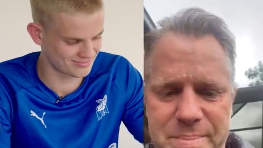 Glenn Archer tears up after being told his son Jackson will play his first AFL game.