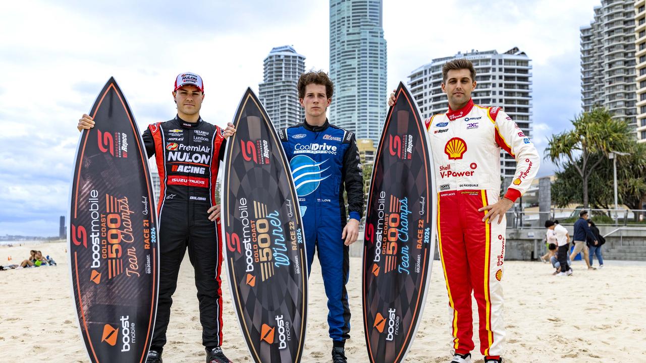 Supercars drivers James Golding, Aaron Love and Andre De Pasquale with the 2024 GC500 trophies on Surfers Paradise beach. Picture: Supplied