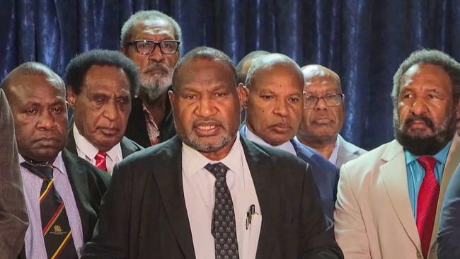 Papua New Guinea's Prime Minister James Marape (C) declaring a 14-day state of emergency in Port Moresby after rioting and looting took place. Picture: AFP