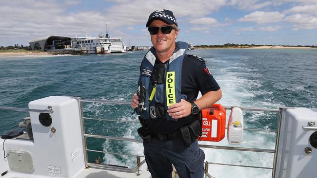 Leading Senior Constable Shaun Wallace heads out through the Rip. Picture: Alan Barber