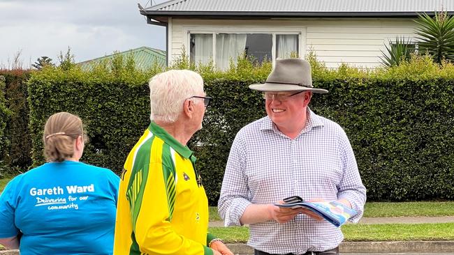 Kiama MP Gareth Ward talking to a voter at Bomaderry Public School on election day. Picture: Dylan Arvela