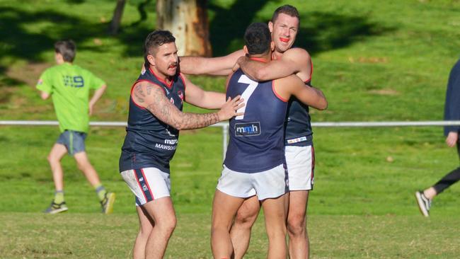 Pooraka players are hoping to be celebrating like they were after this game last year when they play Salisbury in an elimination final this weekend. Picture: Brenton Edwards