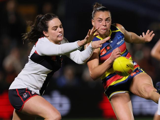 ADELAIDE, AUSTRALIA - OCTOBER 04: Olivia Vesely of the Saints tackles Ebony Marinoff of the Crows during the 2024 AFLW Round 06 match between the Adelaide Crows and the St Kilda Saints at Norwood Oval on October 04, 2024 in Adelaide, Australia. (Photo by James Elsby/AFL Photos via Getty Images)