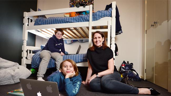 Loucinda McCorry and her sons Alex, 11 and Eli, 9, getting their books out ready for another round of home schooling. Picture: Nicki Connolly