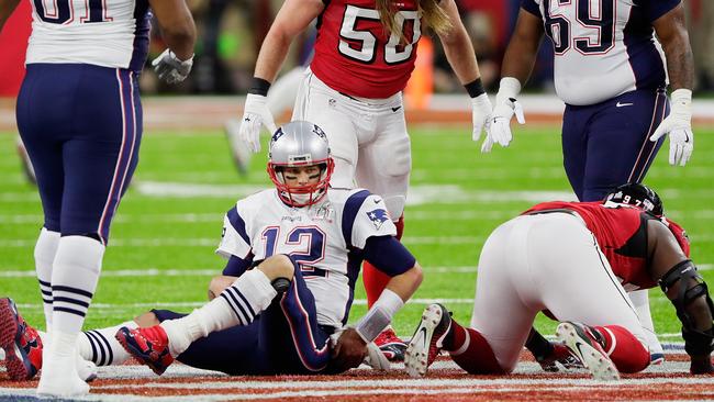 Tom Brady after being sacked by Grady Jarrett. Picture: Getty