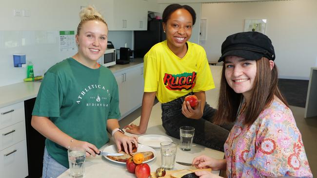 ** HOLD FOR HEALTH OF THE NATION ** . Australian Catholic University first year students Natasha Brierley (Nursing/Paramedicine), Delphine Kawela (Business) and Anika Rossington (Midwifery), work together to make healthy choices in the kitchen on campus. Picture Lachie Millard