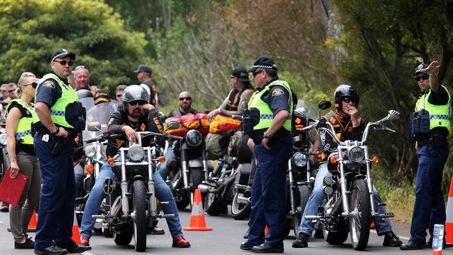 Police keep a watchful eye on the Bandidos' motorcycle gang as they arrive in Burnie. Picture: CHRIS KIDD