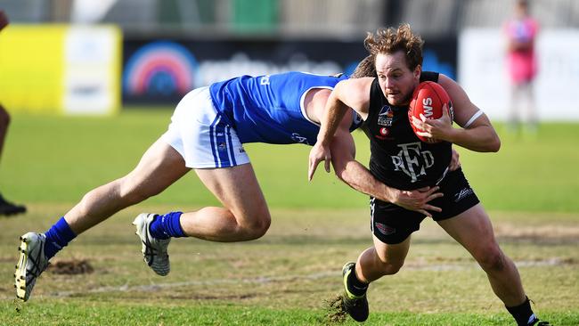 Port District’s James Batty (right) was found to have returned to the field too early after receiving a yellow card on Saturday. Picture: AAP/Mark Brake