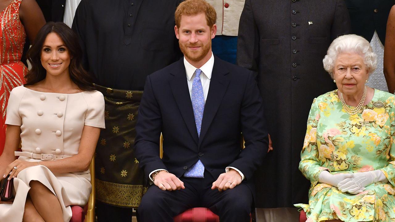 Meghan, Prince Harry, and Queen Elizabeth II at the Queen's Young Leaders Awards Ceremony at Buckingham Palace on June 26, 2018. Picture: John Stillwell – WPA Pool/Getty Images.