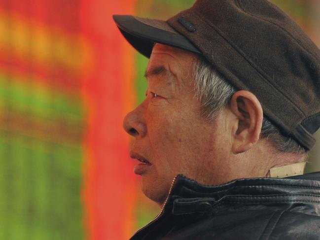 A Chinese stock investor monitors prices at a brokerage house in Fuyang in central China's Anhui province Thursday, Jan. 21, 2016. Asian stock markets were mostly in the red Thursday, surrendering early gains as oil drifted lower and sentiment remained fragile following big swings on Wall Street. (Chinatopix via AP) CHINA OUT