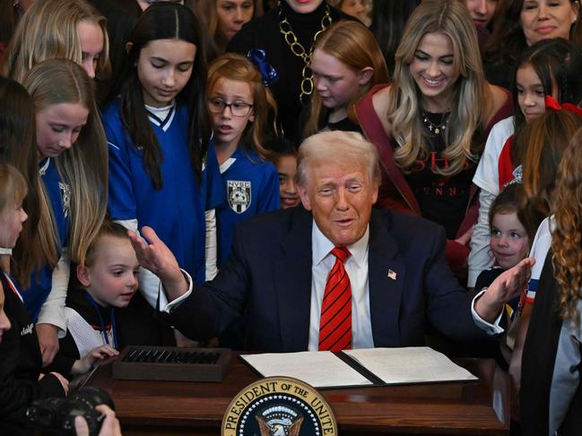 US President Donald Trump signs the No Men in Women’s Sports Executive Order into law in the East Room of the White House. Picture: AFP