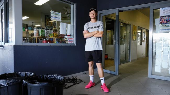 The Cairns International Tennis Centre was broken into twice on early Monday morning, with the burglars stealing a car owned by Tennis Queensland. Head coach assistant of Baseline Tennis coaching academy Alwyn Musumeci stands in front of the glass panel doors that were smashed to enter the tennis clubhouse and offices. Picture: Brendan Radke