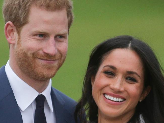 (FILES) In this file photo taken on November 27, 2017 Britain's Prince Harry and his fiancÃ©e US actress Meghan Markle pose for a photograph in the Sunken Garden at Kensington Palace in west London, following the announcement of their engagement. - Prince Harry and Meghan Markle officially launched their new Hollywood careers on September 2, 2020, signing a deal with Netflix to produce "impactful" films and series for the streaming giant. (Photo by Daniel LEAL-OLIVAS / AFP)