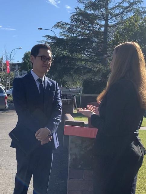 Jack Hugh speaks to his lawyer after being charged over a public masturbating incident. Picture: Madelaine Wong