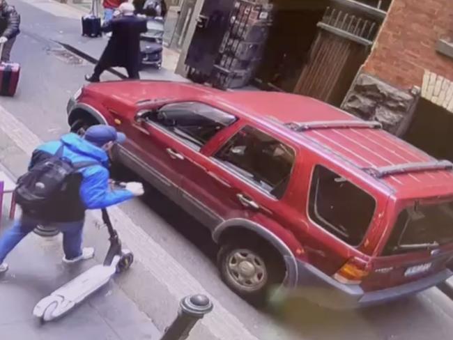 The man inspected the car before driving off.