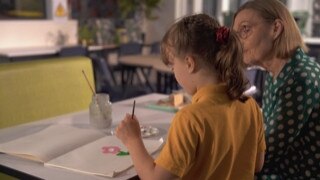 A Kids Hope Australia mentor works with a young student.