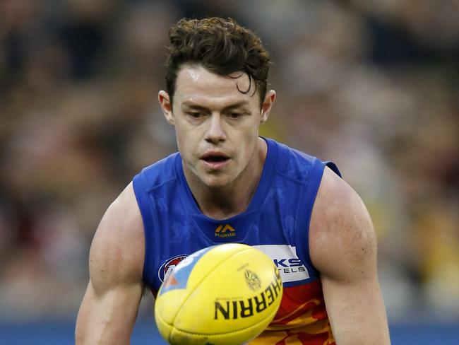 MELBOURNE, AUSTRALIA - AUGUST 25: Lachie Neale of the Lions gathers the ball during the round 23 AFL match between the Richmond Tigers and the Brisbane Lions at Melbourne Cricket Ground on August 25, 2019 in Melbourne, Australia. (Photo by Darrian Traynor/Getty Images)