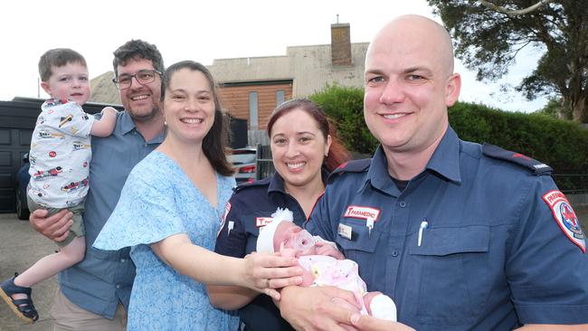 Dad Nick Robins holding son William, 2, Kathryn Robins, paramedics Tiana Robertson and Jacob Morris, holding baby Madison, on the spot where the baby was born. Picture : Mark Wilson