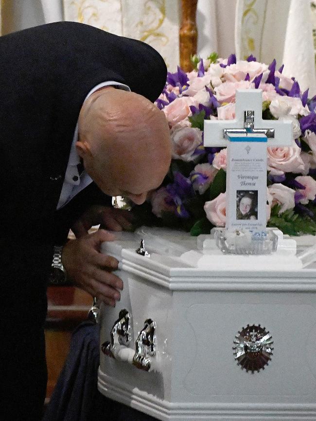 Bob Sakr kisses the coffin of his daughter Veronique Sakr at the Santa Sabina College Chapel in Strathfield on February 11, 2020. Picture: Bianca De Marchi