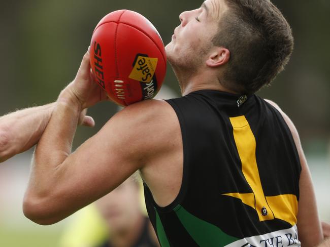 Billy Geurts wins the ball for Dromana. Picture: Valeriu Campan