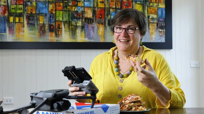 In between bites of her medium Veggie Lovers, Nikki Huddy from Planz Town Planning is urging disaster recovery agencies to explore new ways of responding to crises. Image: Brendan Radke