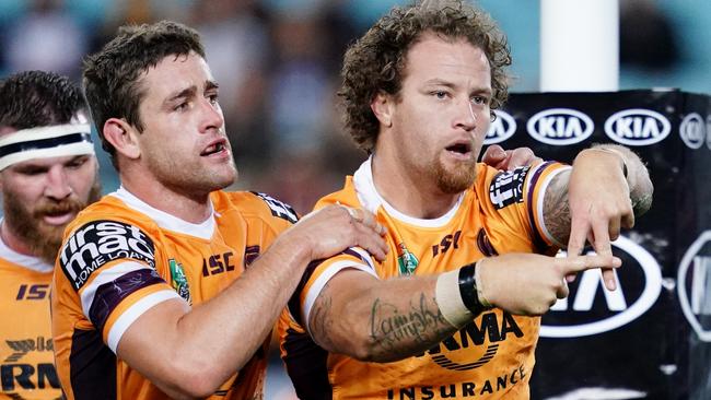 Korbin Sims throws signs after bagging his second try. (Cameron Spencer/Getty Images)