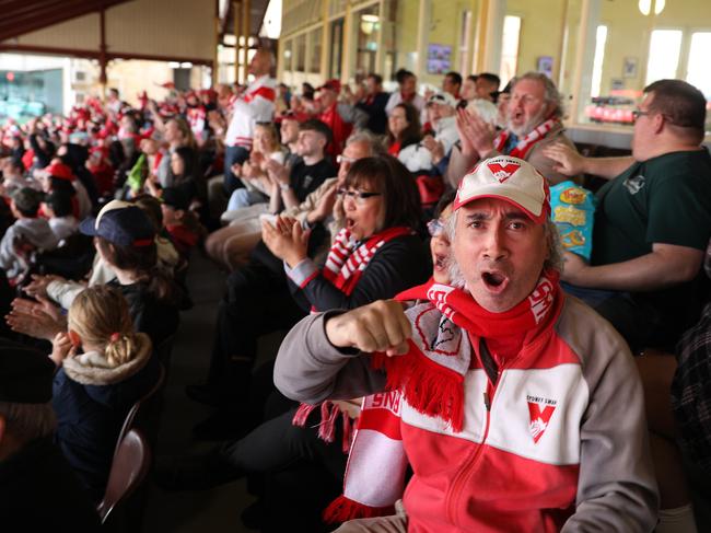 Sydney Swans fans watch a broadcast of the 2024 AFL Grand Final - under cover - at the Sydney Cricket Ground. Picture: NewsWire